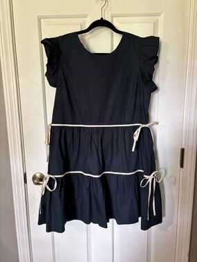 Navy Ruffle Sleeve Tiered Dress with Cream Ties. So cute! Worn 1x. Size large.